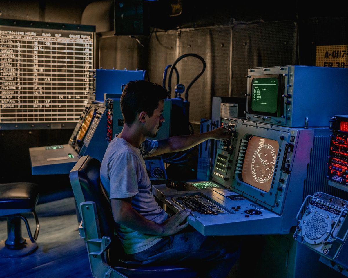 A man in front of a monitor